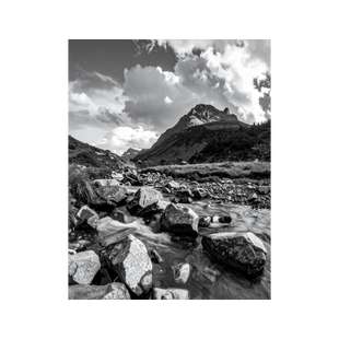 Wandbild Bergsee mit Steinen Schwarz Weiss